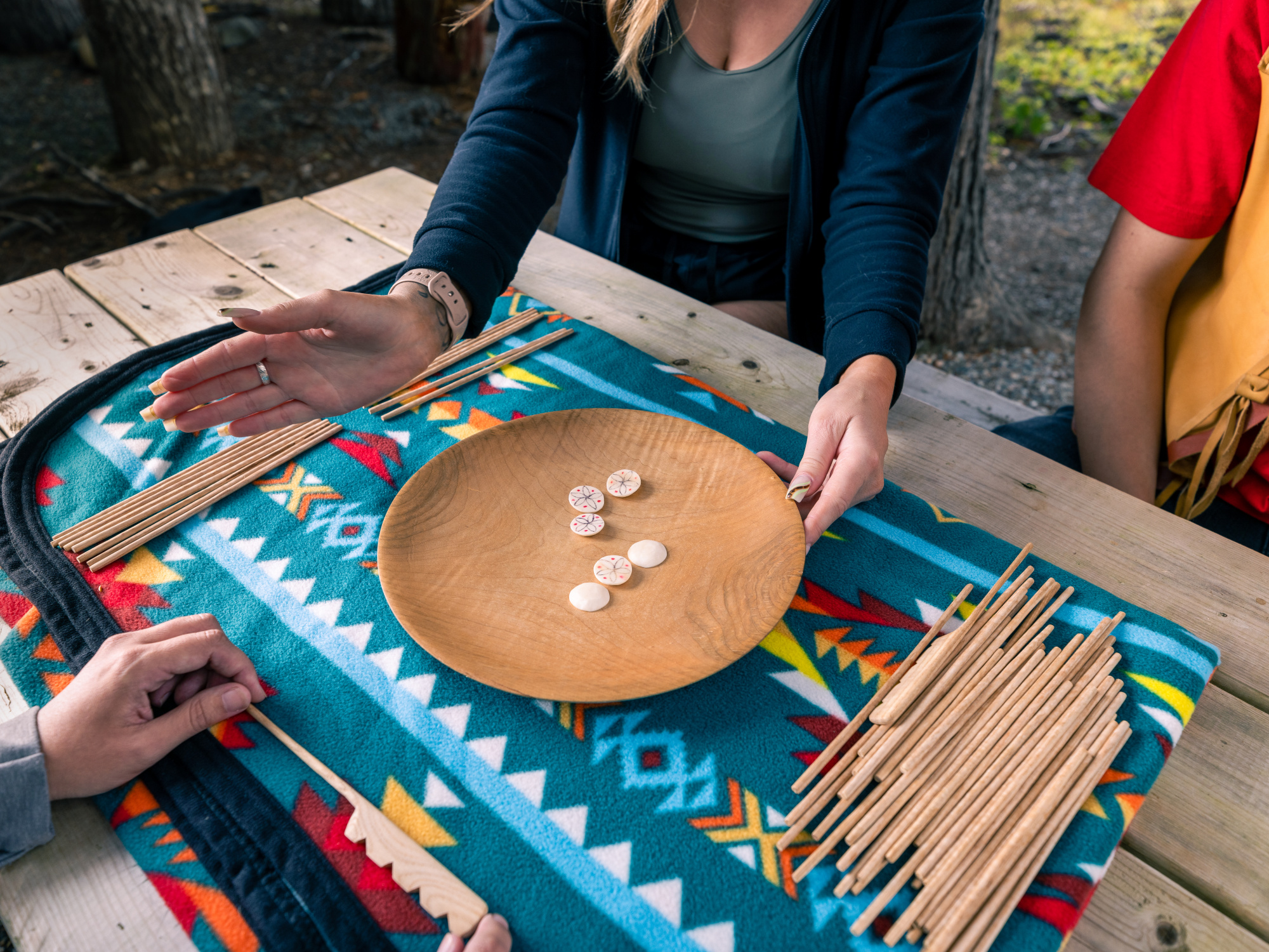 Experiencing Eskasoni Cultural Journeys. Waltes Dish and Counters on a table with a colourful cloth.